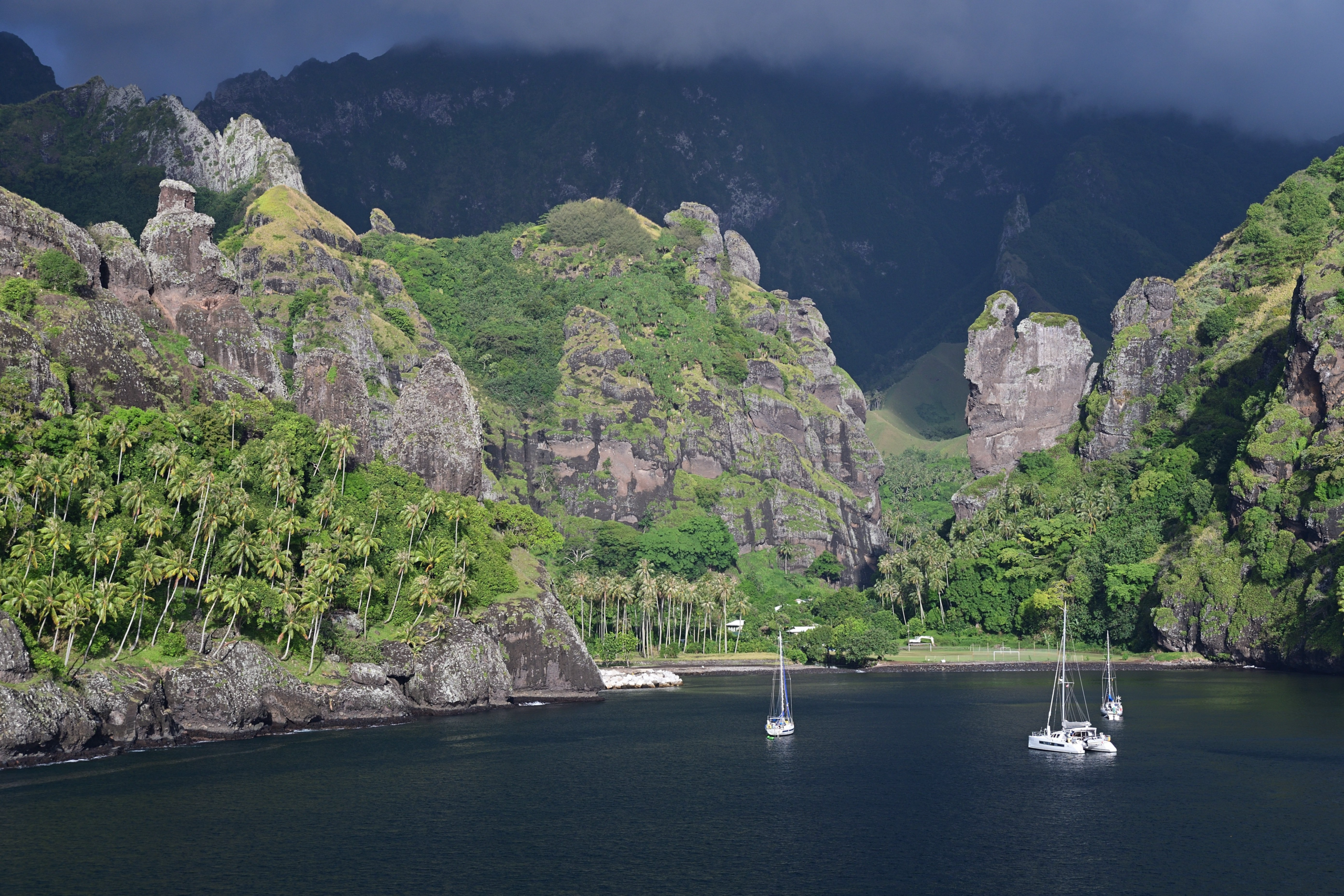 Sailboats in a Marquesas bay — Polynesia charter region